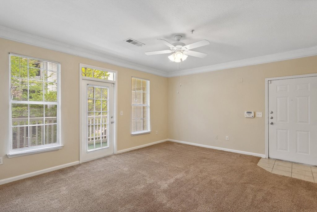 Living room with ceiling fan at Longwood Vista Apartment Homes in Atlanta GA